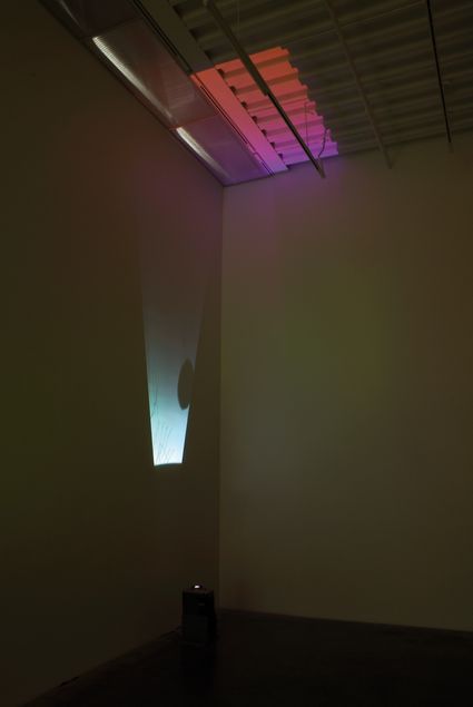 Abstract colored light projection on the wall and ceiling.