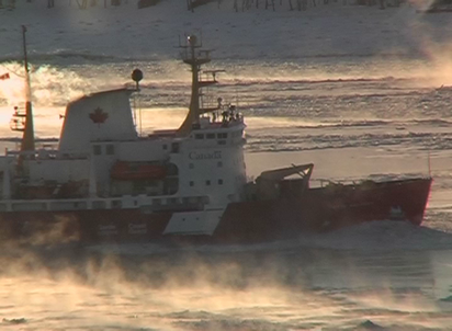  A ship with the inscription "Canada" and a maple leaf symbol sails through steaming waters. 