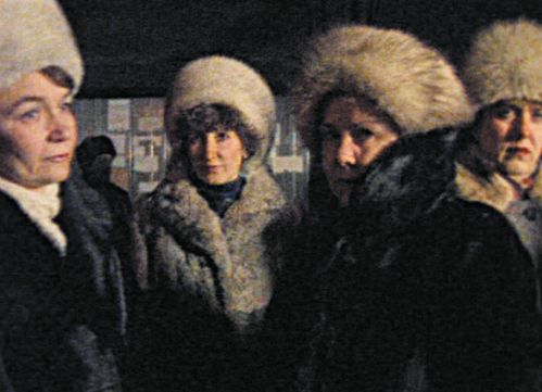 A group of women with fur coats and hats