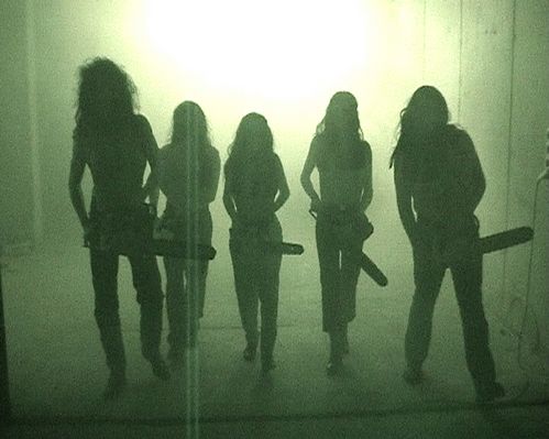 The silhouettes of five people with long hair holding chainsaws