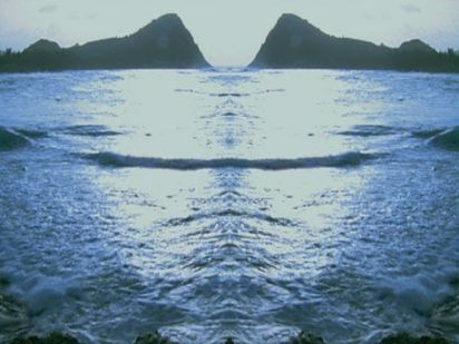 Symmetrical reflection of a caribbean island landscape